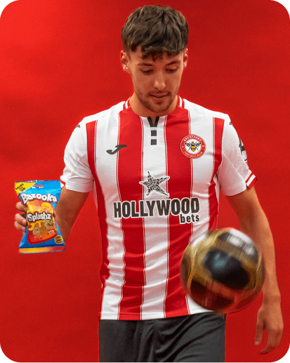 Footballer holding a bag of sweets