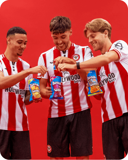 Footballer looking up at a bag of sweets